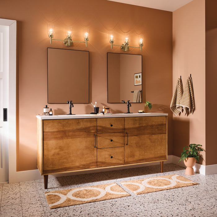 Kichler - 55185CPZ - Three Light Vanity - Madden - Champagne Bronze